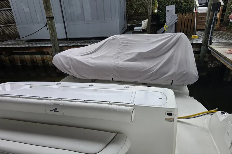 Slide: The Image of 2007 Sea Ray 52 Sedan Bridge yacht with covered equipment on deck, docked in marina. - 16