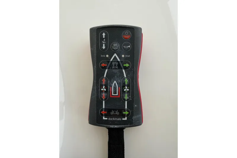 Slide: The Image of Remote control for 2007 Sea Ray 52 Sedan Bridge yacht, featuring directional buttons and indicators. - 35
