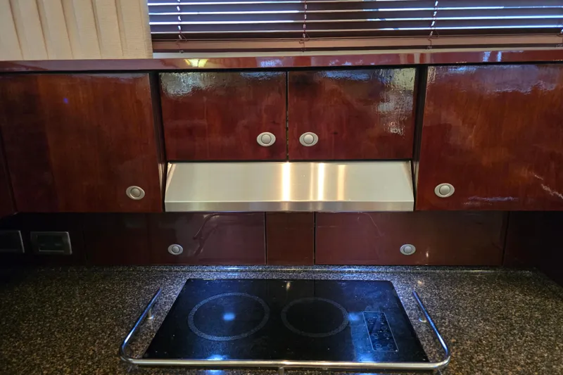Slide: The Image of Luxurious kitchen area in a 2007 Sea Ray 52 Sedan Bridge yacht with sleek cabinetry. - 50