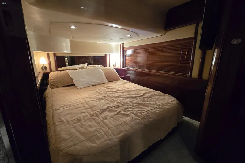 Slide: The Image of Luxurious bedroom interior of 2007 Sea Ray 52 Sedan Bridge yacht. - 54