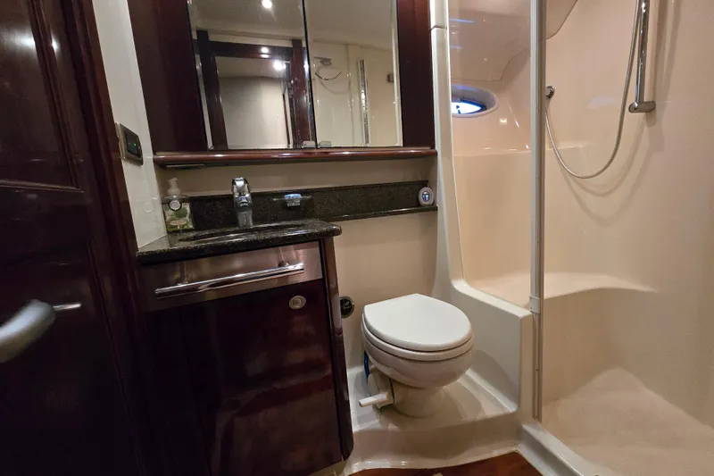 Slide: The Image of Luxurious bathroom in 2007 Sea Ray 52 Sedan Bridge yacht with shower and vanity. - 57