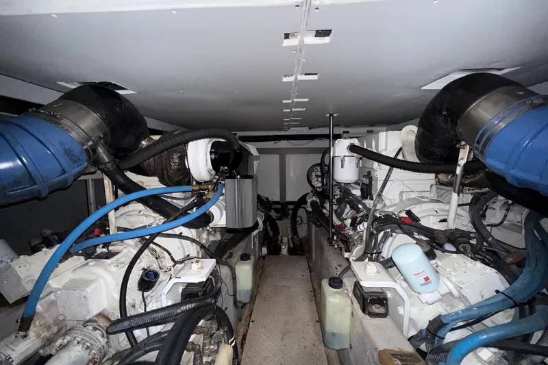 Slide: The Image of Engine room of a 2007 Sea Ray 52 Sedan Bridge yacht, showcasing dual engines and components. - 70
