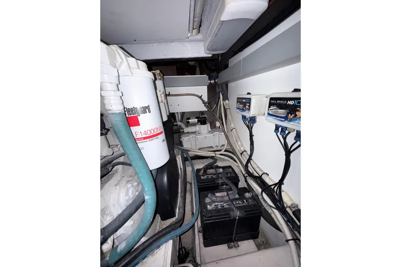 Slide: The Image of Engine room of 2007 Sea Ray 52 Sedan Bridge with batteries and wiring. - 74