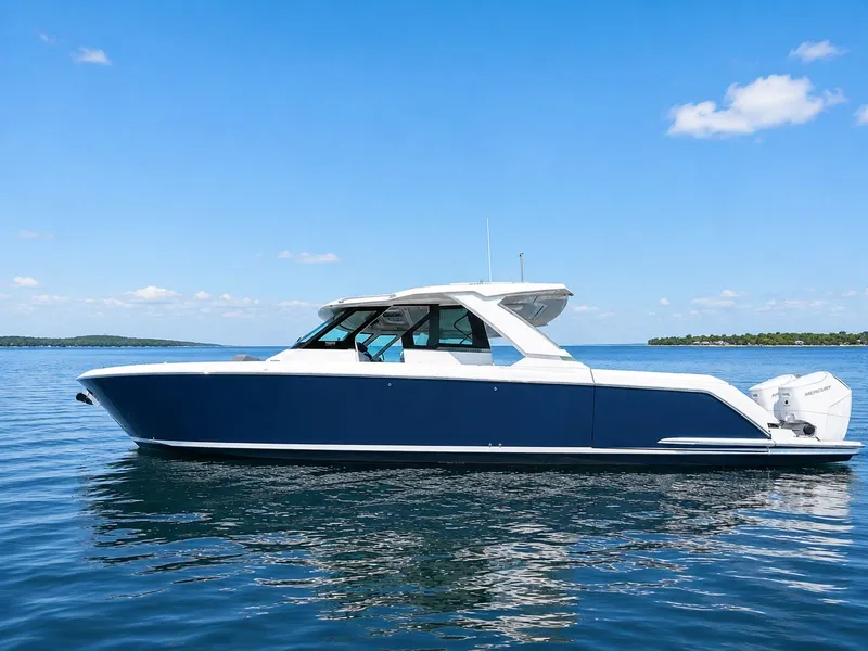 The Image of 2023 Tiara Yachts 48 LS on calm water under clear sky. - 0