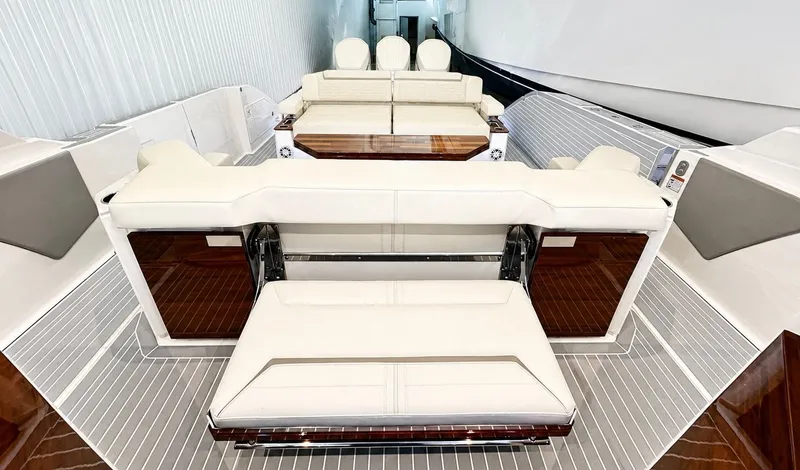 Slide: The Image of Interior of 2023 Tiara Yachts 48 LS with luxurious white seating. - 11