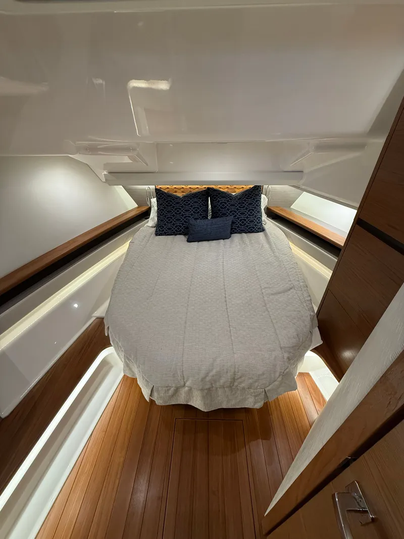 Slide: The Image of Interior of 2023 Tiara Yachts 48 LS featuring cozy bed. - 17