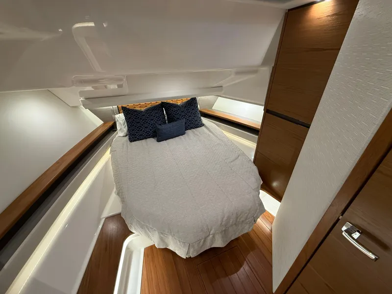 Slide: The Image of Interior of 2023 Tiara Yachts 48 LS featuring cozy bedroom. - 18