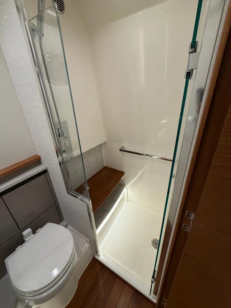 Slide: The Image of Luxurious bathroom of 2023 Tiara Yachts 48 LS with shower and toilet. - 20