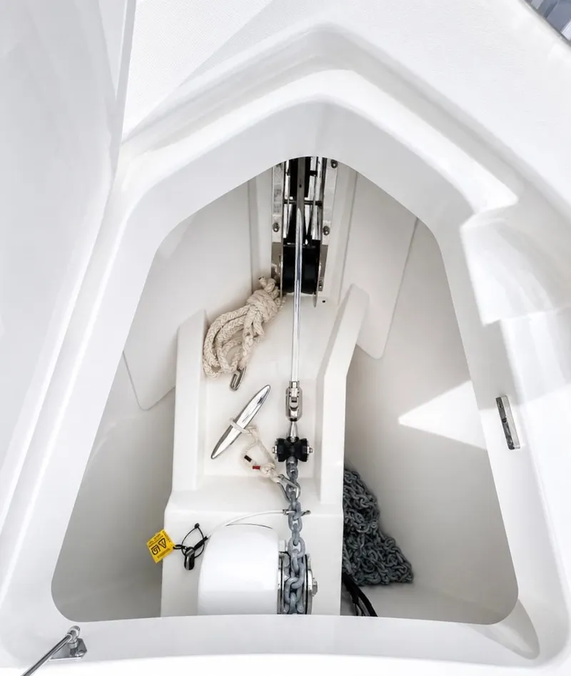 Slide: The Image of Anchor locker of 2023 Tiara Yachts 48 LS with chain and rope. - 23