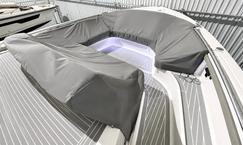 Slide: The Image of 2023 Tiara Yachts 48 LS with gray covers and LED lighting. - 29