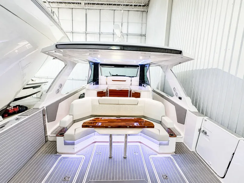 Slide: The Image of Interior of 2023 Tiara Yachts 48 LS featuring luxurious seating area. - 3