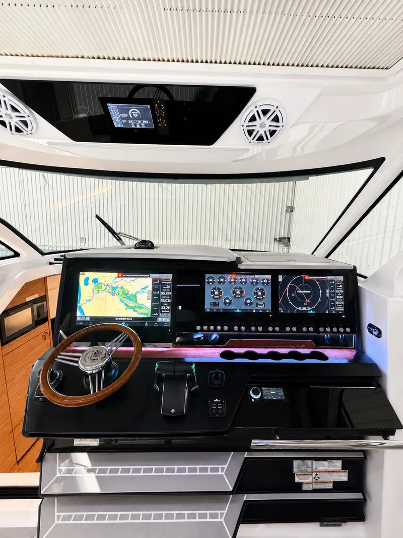 Slide: The Image of 2023 Tiara Yachts 48 LS cockpit with advanced navigation system. - 6