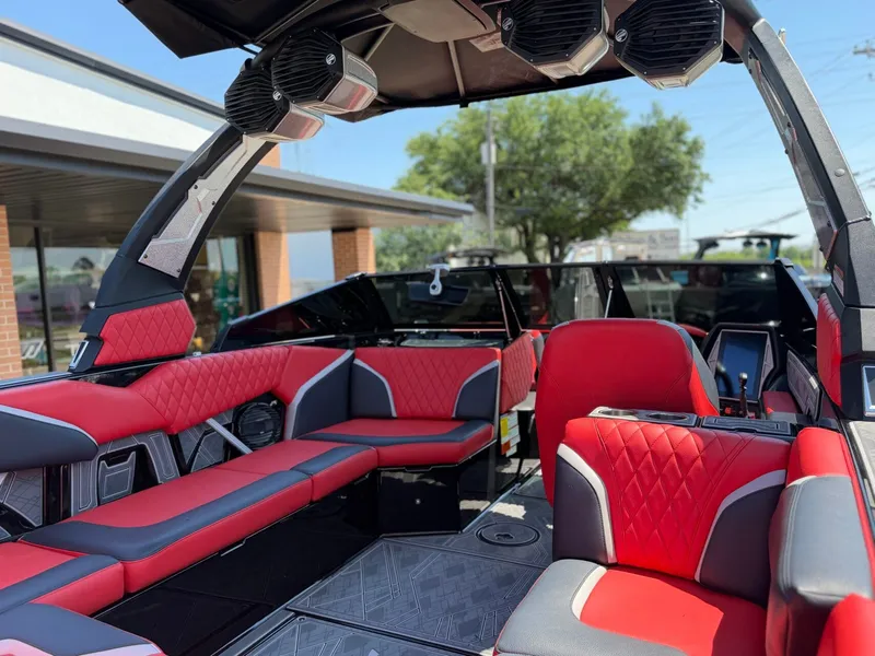 Slide: The Image of Interior of 2023 Tigé 24RZX with red seating and speakers. - 11