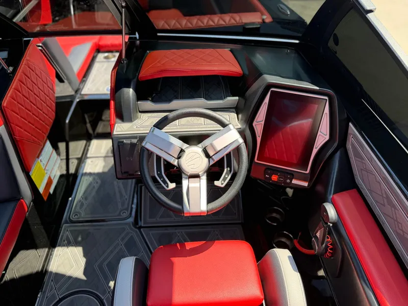 Slide: The Image of 2023 Tigé 24RZX interior with red and black design. - 12