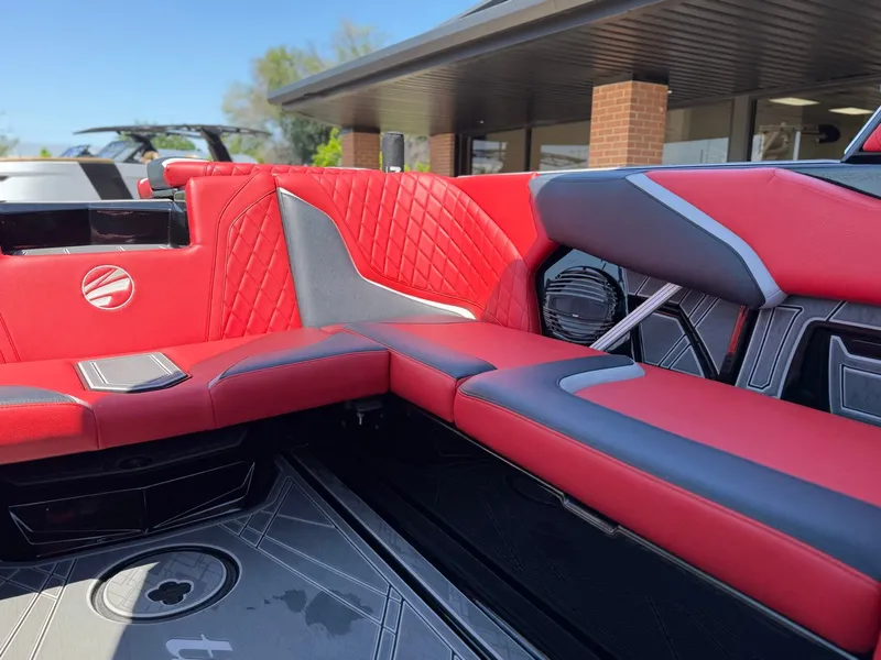 Slide: The Image of Interior of 2023 Tigé 24RZX with red leather seating. - 14