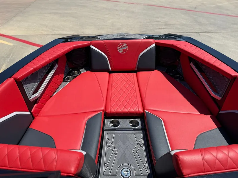 Slide: The Image of Interior of 2023 Tigé 24RZX with red leather seating. - 16