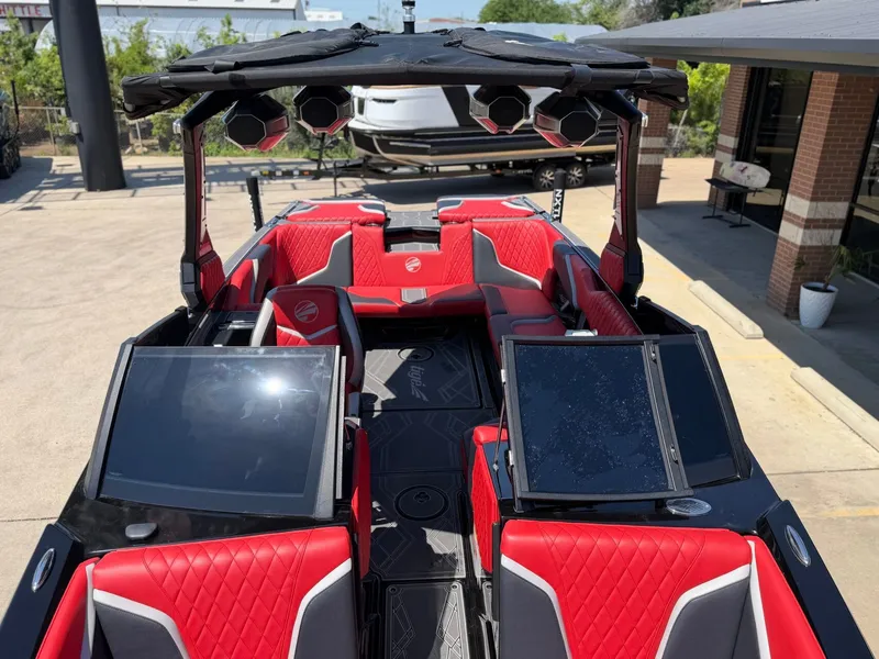 Slide: The Image of Interior of 2023 Tigé 24RZX boat with red seating. - 17