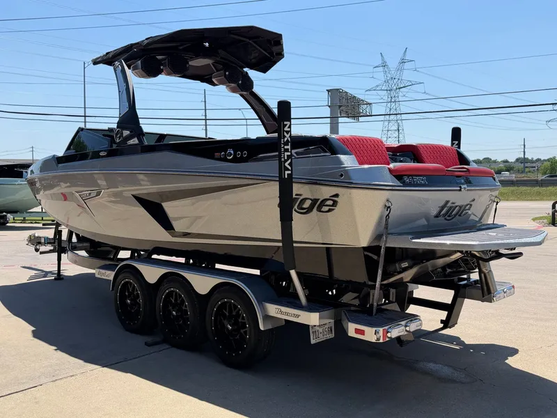 Slide: The Image of 2023 Tigé 24RZX boat on trailer, side view. - 5