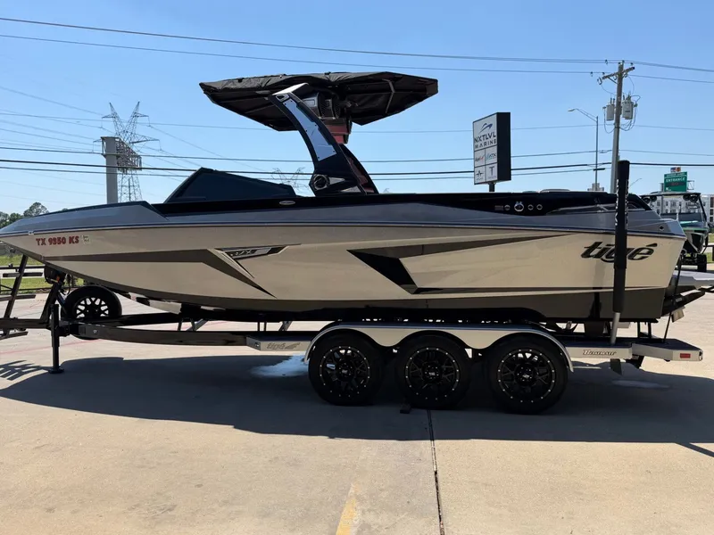 Slide: The Image of 2023 Tigé 24RZX boat on trailer, side view. - 6