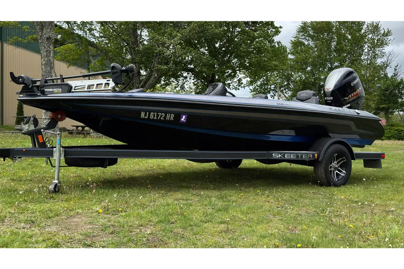 The Image of 2022 Skeeter ZX150 boat parked on trailer outdoors. - 0