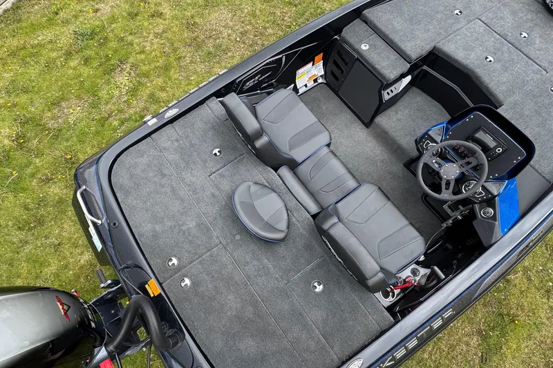 Slide: The Image of 2022 Skeeter ZX150 boat interior with dual seats and steering console, viewed from above. - 21