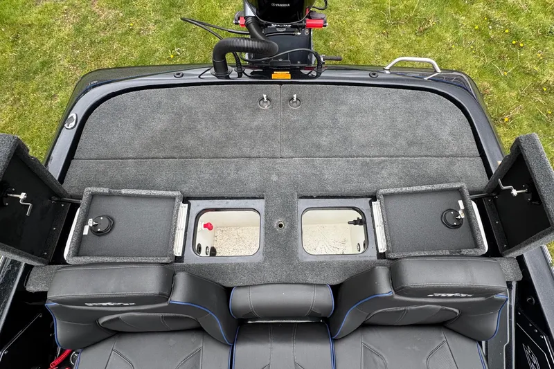 Slide: The Image of 2022 Skeeter ZX150 boat interior with storage compartments and seating. - 22