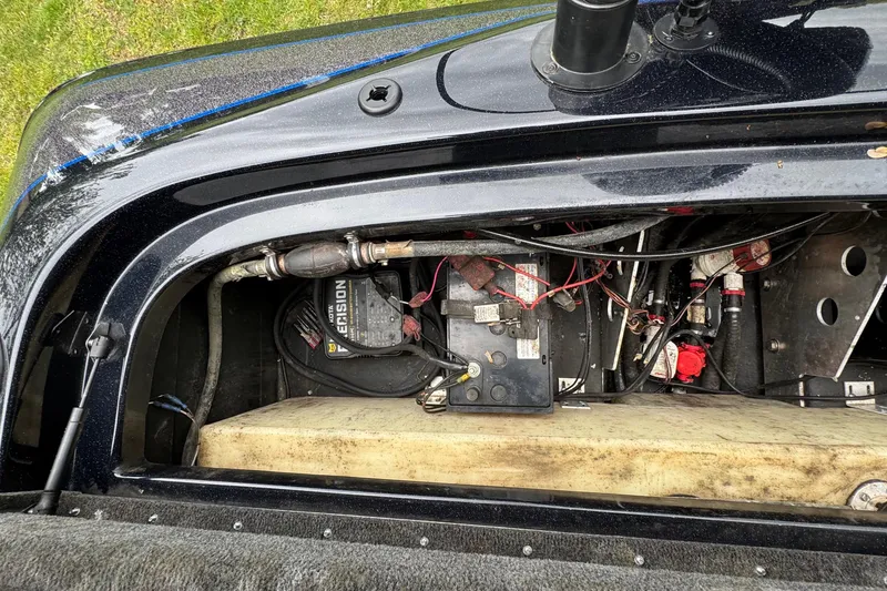 Slide: The Image of 2022 Skeeter ZX150 boat battery compartment with wiring and components. - 25