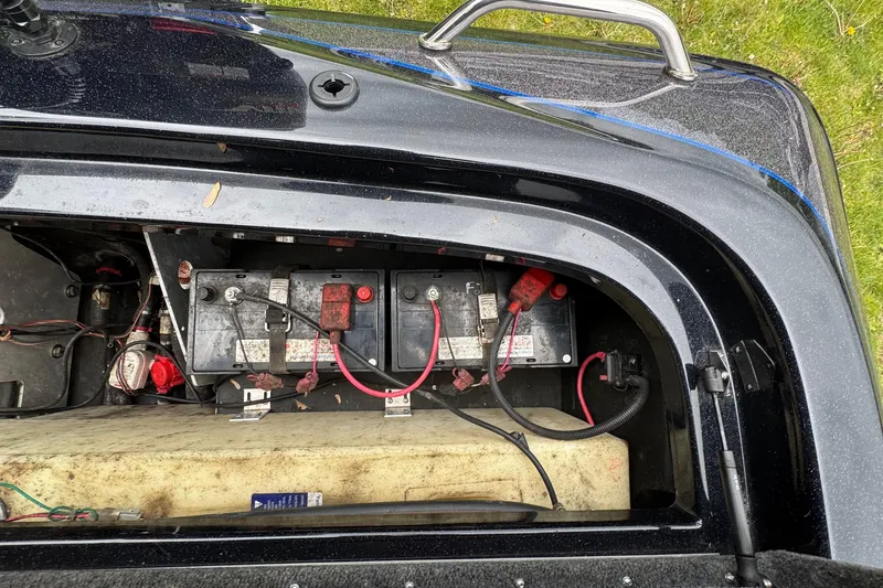 Slide: The Image of Battery compartment of a 2022 Skeeter ZX150 boat, showing wiring and components. - 26