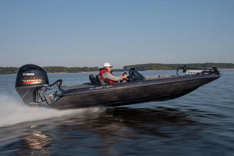 Slide: The Image of Manufacturer Provided Image: 2022 Skeeter ZX 150 bass boat speeding on a lake. - 7