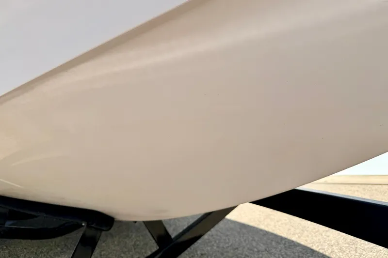 Slide: The Image of Close-up of 2014 Nautique Super Air Nautique 210 boat hull on trailer. - 99