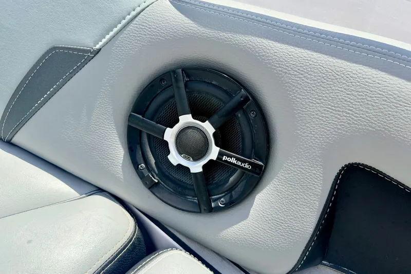 Slide: The Image of Polk Audio speaker on 2014 Nautique Super Air Nautique 210 boat interior. - 74