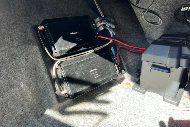 Slide: The Image of Audio system components in a 2014 Nautique Super Air Nautique 210 boat. - 21