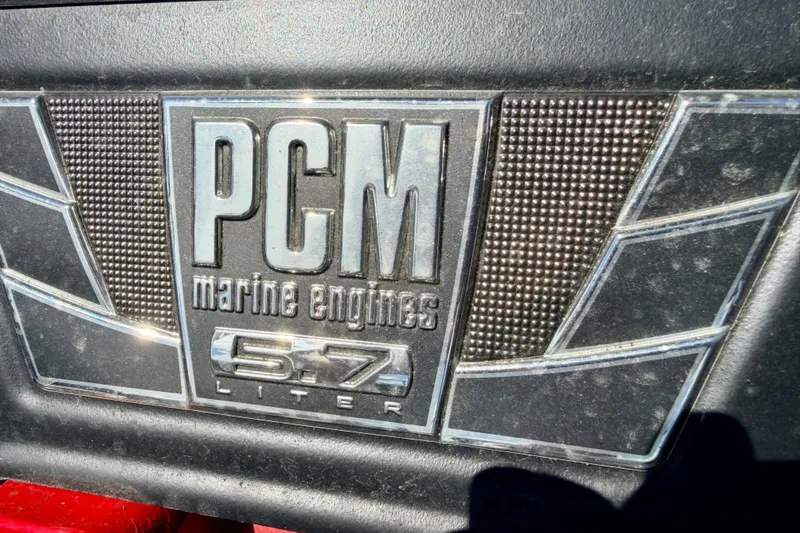 Slide: The Image of PCM marine engine badge, 5.7-liter, on 2014 Nautique Super Air Nautique 210. - 30