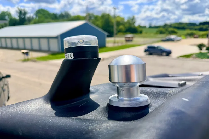 Slide: The Image of Close-up of 2014 Nautique Super Air Nautique 210 boat hardware under sunny sky. - 93