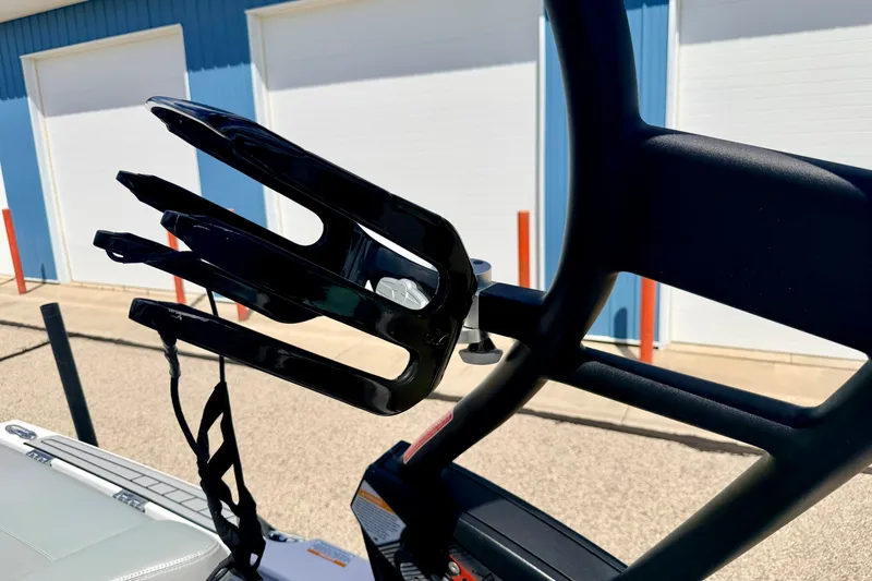 Slide: The Image of 2014 Nautique Super Air Nautique 210 wakeboard rack, close-up view. - 89