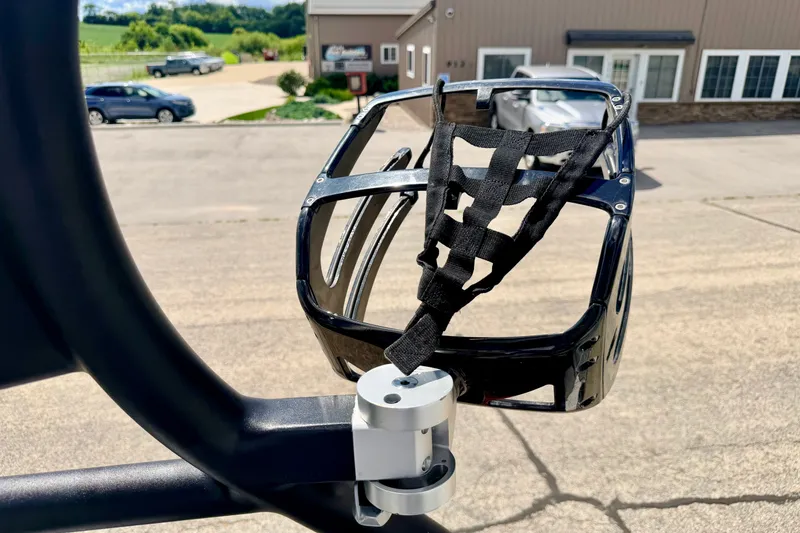Slide: The Image of Side mirror of a 2014 Nautique Super Air Nautique 210 boat with strap detail. - 88