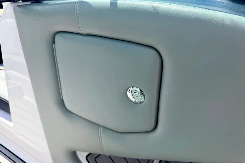 Slide: The Image of 2014 Nautique Super Air Nautique 210 interior detail with sleek gray panel and chrome accent. - 65