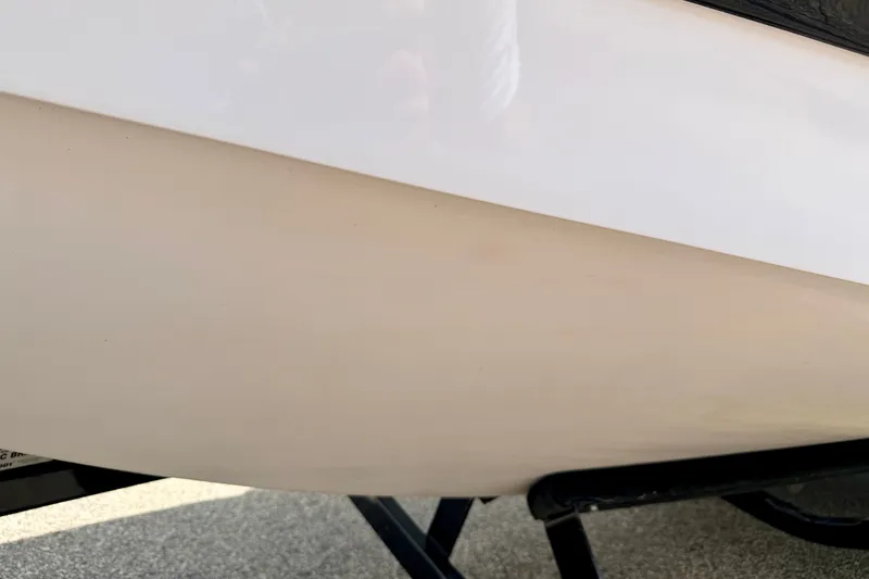 Slide: The Image of Close-up of 2014 Nautique Super Air Nautique 210 boat hull on trailer. - 100