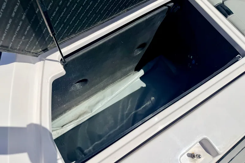 Slide: The Image of Open storage compartment in 2014 Nautique Super Air Nautique 210 boat. - 28