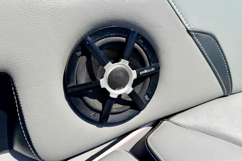 Slide: The Image of Polk Audio speaker on 2014 Nautique Super Air Nautique 210 boat interior. - 75