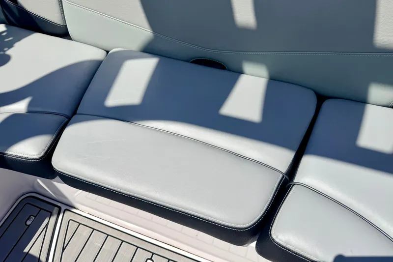 Slide: The Image of 2014 Nautique Super Air Nautique 210 boat seat with gray upholstery. - 39