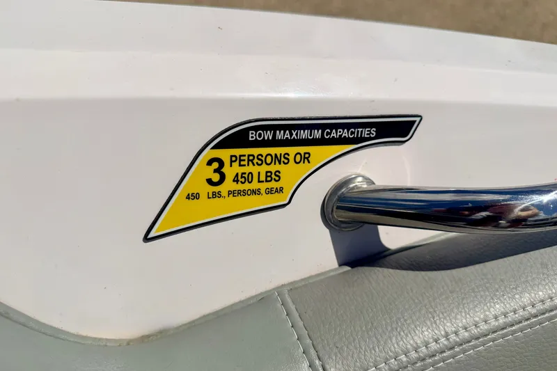 Slide: The Image of 2014 Nautique Super Air Nautique 210 capacity label, 3 persons or 450 lbs limit. - 77