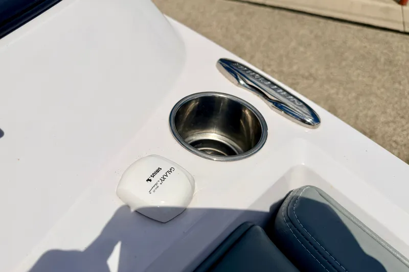Slide: The Image of 2014 Nautique Super Air Nautique 210 boat detail with cup holder and Galaxy Sirius control. - 79