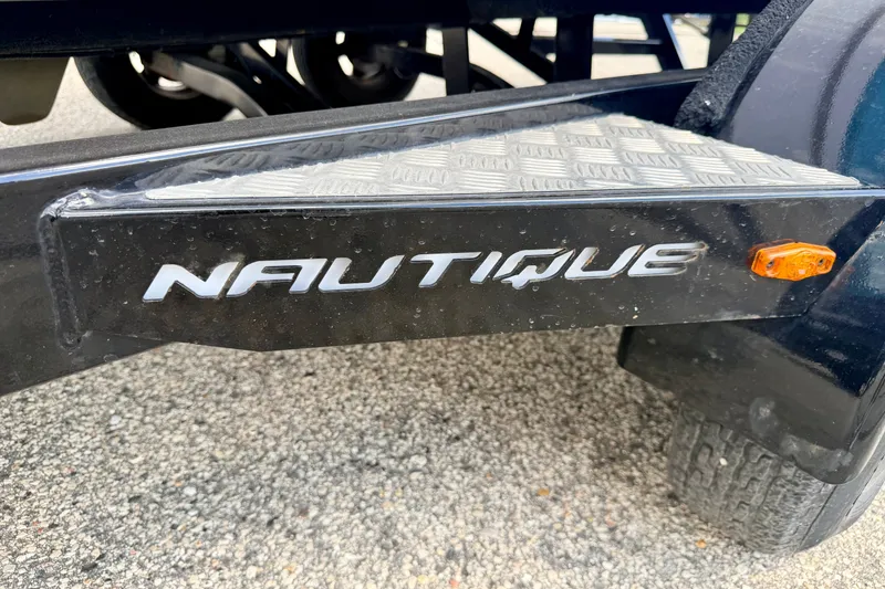 Slide: The Image of Trailer detail of 2014 Nautique Super Air Nautique 210 with logo and reflector. - 103