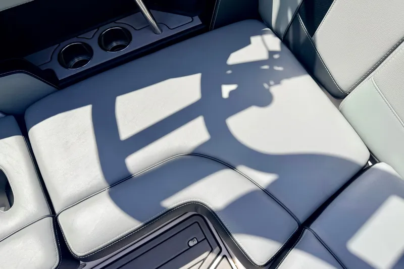 Slide: The Image of Interior seating of 2014 Nautique Super Air Nautique 210 boat with cup holders. - 37