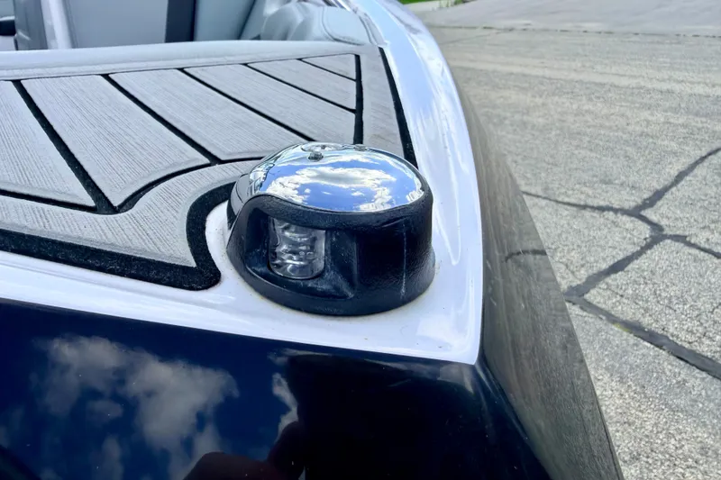 Slide: The Image of 2014 Nautique Super Air Nautique 210 boat detail with chrome navigation light. - 109