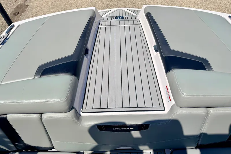 Slide: The Image of 2014 Nautique Super Air Nautique 210 boat deck with sleek gray upholstery. - 33