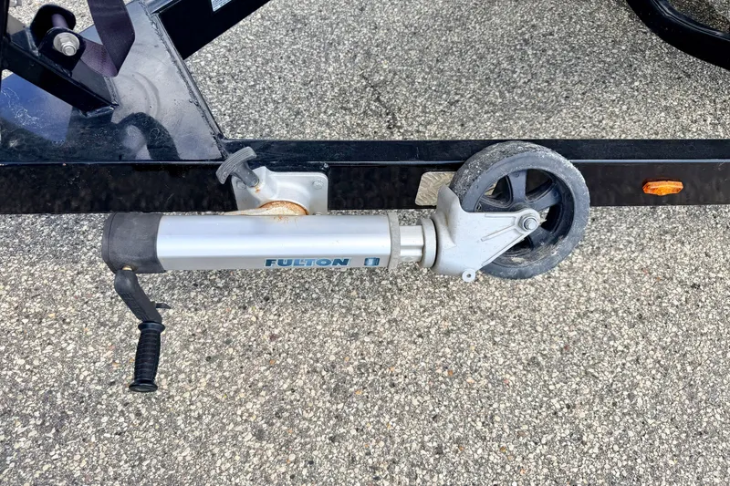 Slide: The Image of Trailer jack wheel on 2014 Nautique Super Air Nautique 210 boat trailer. - 102