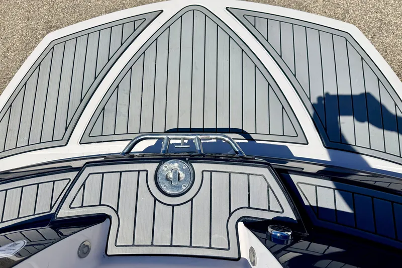 Slide: The Image of 2014 Nautique Super Air Nautique 210 boat deck with sleek gray and black design. - 21