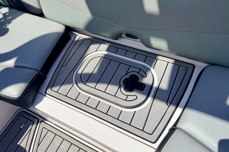 Slide: The Image of 2014 Nautique Super Air Nautique 210 boat interior with sleek seating and deck design. - 40